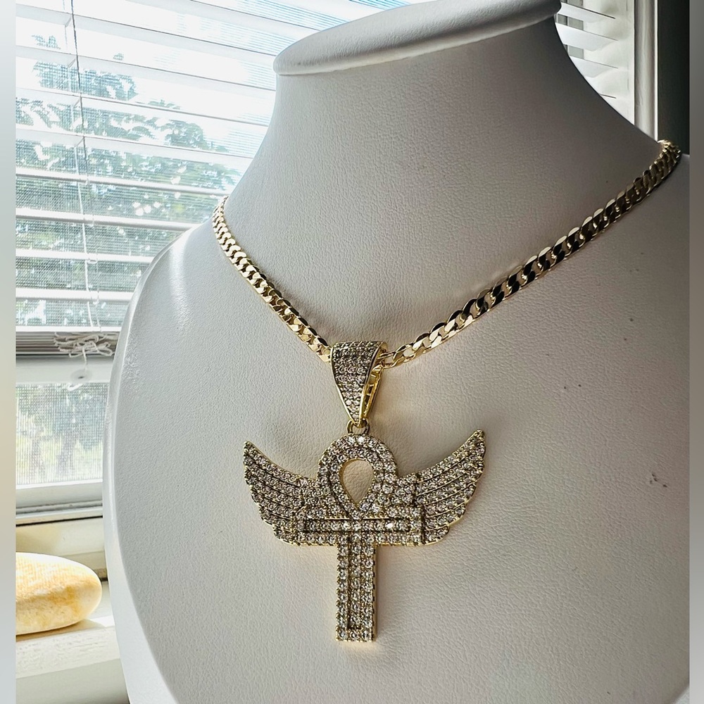 Cuban link chain with ansata cross pendant and wings polished in zirconia.